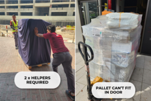 Helpers moving large pallet outside